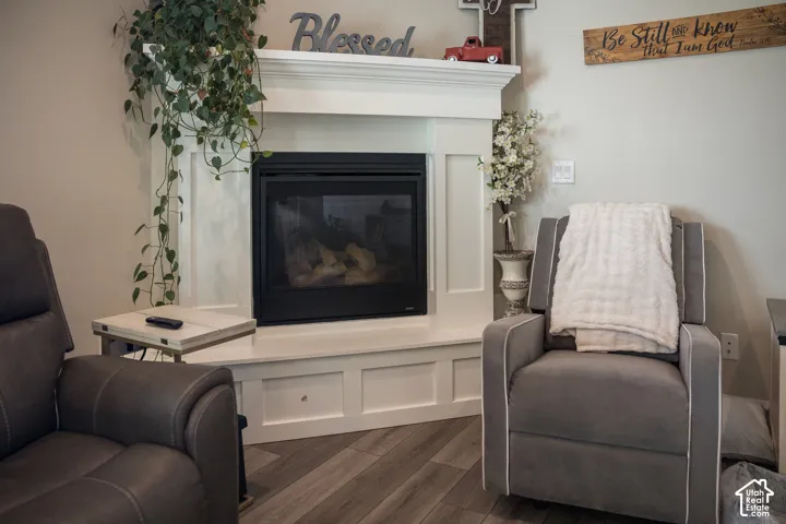 White-painted fireplace surround with a dark-faced firebox