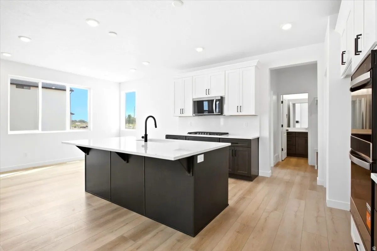 Upgraded Quartz Cabinets with Easy to Clean Quartz Backsplash.