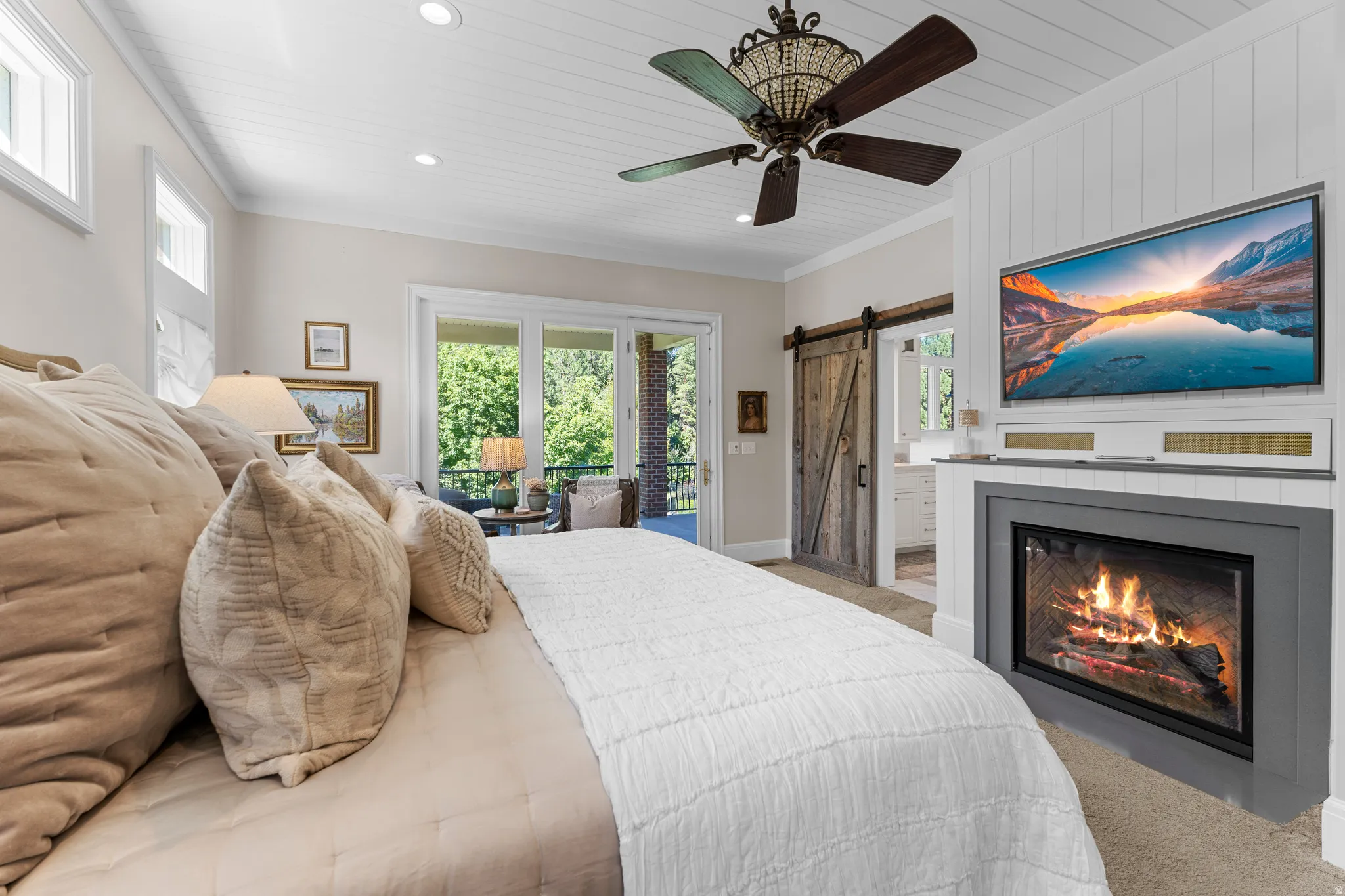 Shiplap ceiling with recessed lighting and a decorative ceiling fan