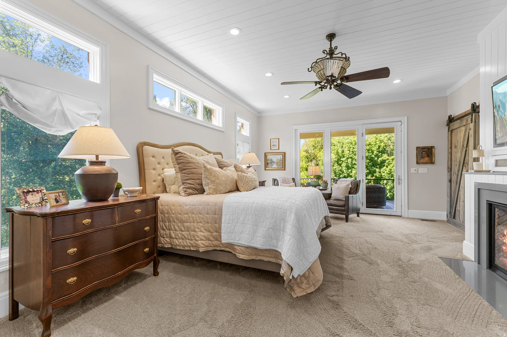 Carpeted room with a paneled ceiling, recessed lighting, and a ceiling fan