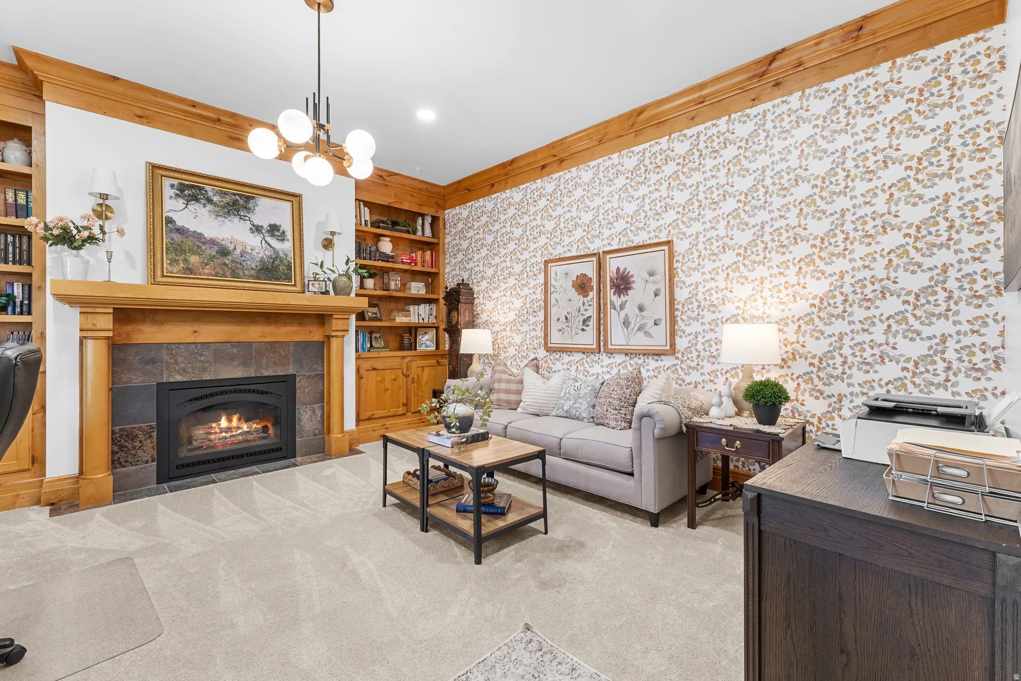 Built-in cabinetry, fireplace with a tile surround, and carpet flooring