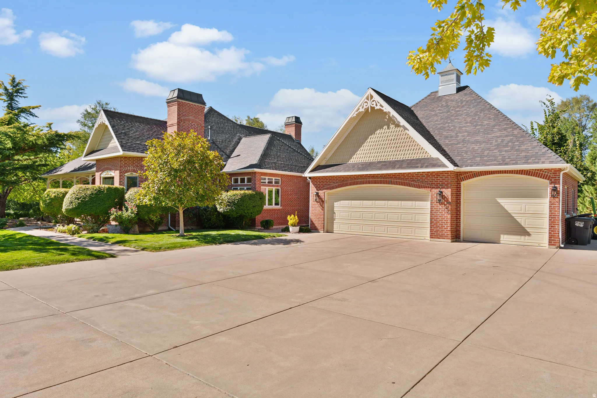 Brick exterior with decorative gables and multiple chimneys