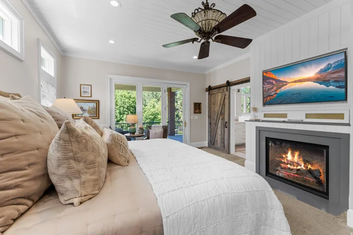 Shiplap ceiling with recessed lighting and a decorative ceiling fan