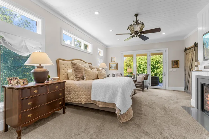 Carpeted room with a paneled ceiling, recessed lighting, and a ceiling fan