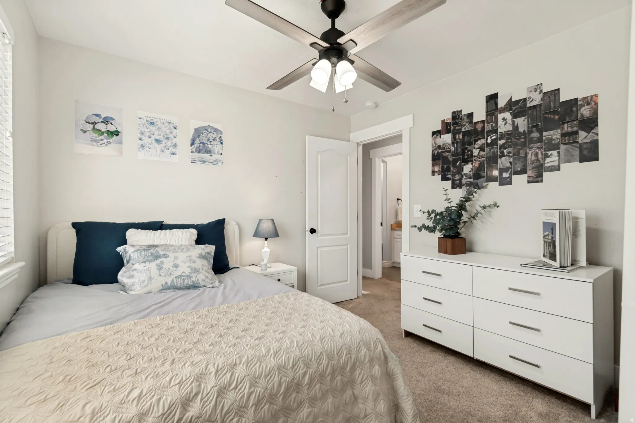 Neutral wall paint, ceiling fan with light fixture, carpet flooring, and white trim work