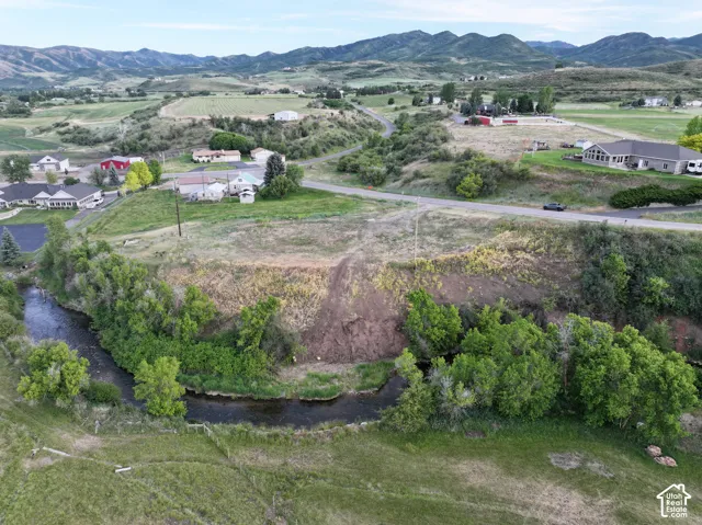 Rolling hills and distant mountains provide a natural backdrop
