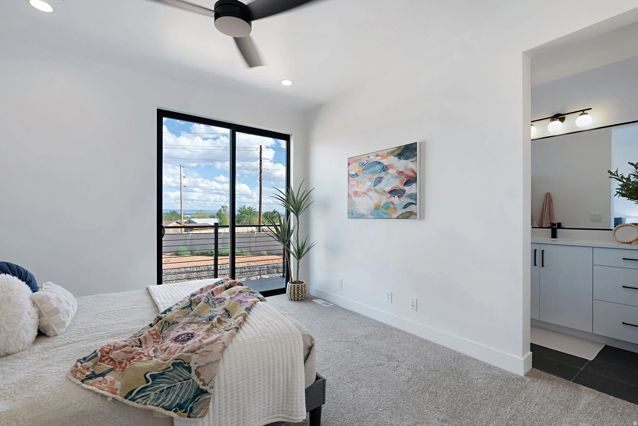Recessed lighting, ceiling fan, and carpeted flooring