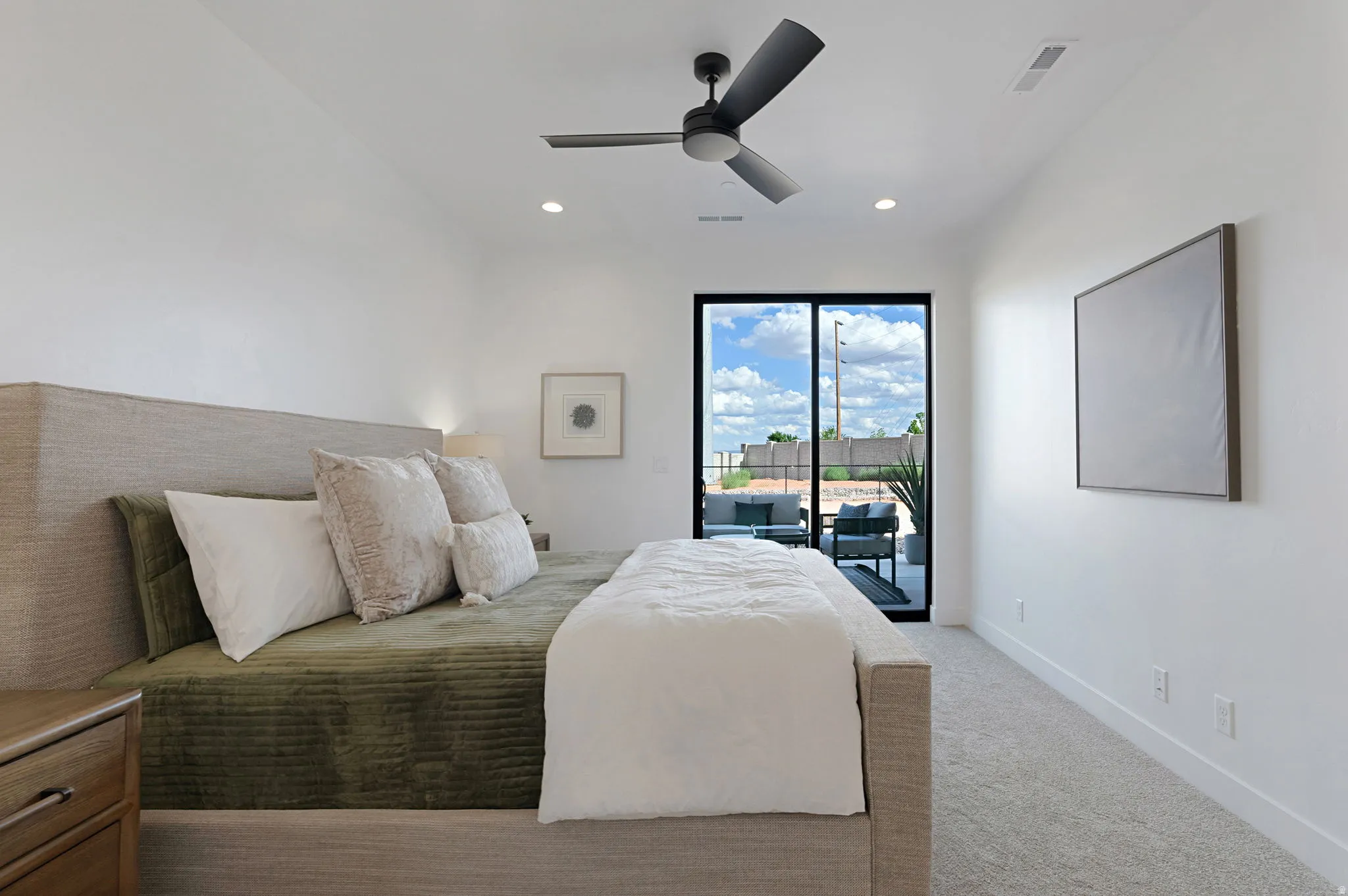 Recessed lighting, ceiling fan, and carpeted flooring