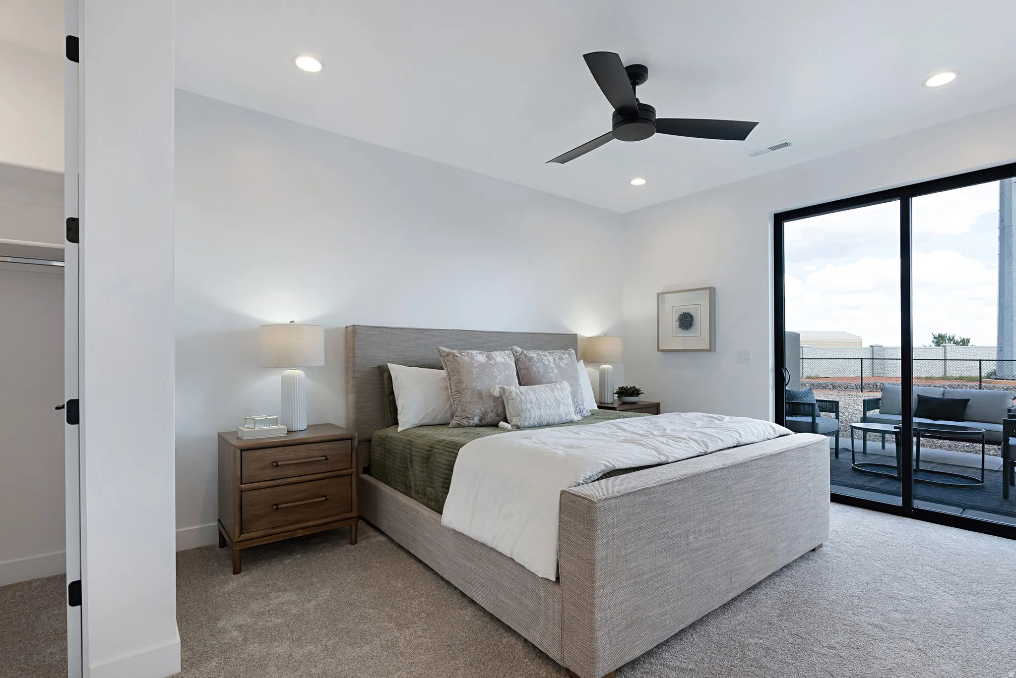 Recessed lighting, ceiling fan, sliding glass door, private patio, and carpeted flooring