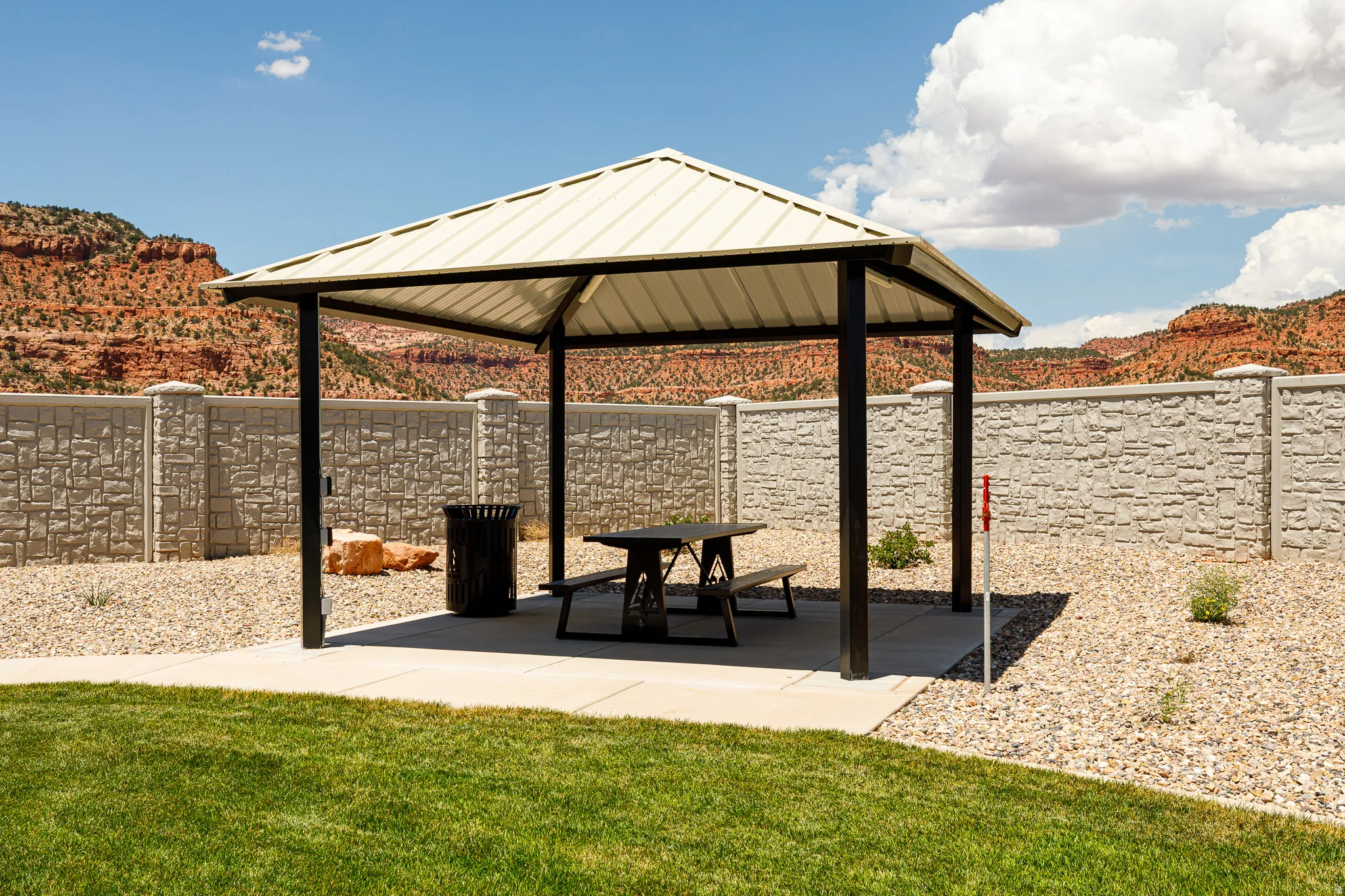 Gazebo with a metal roof and concrete pad