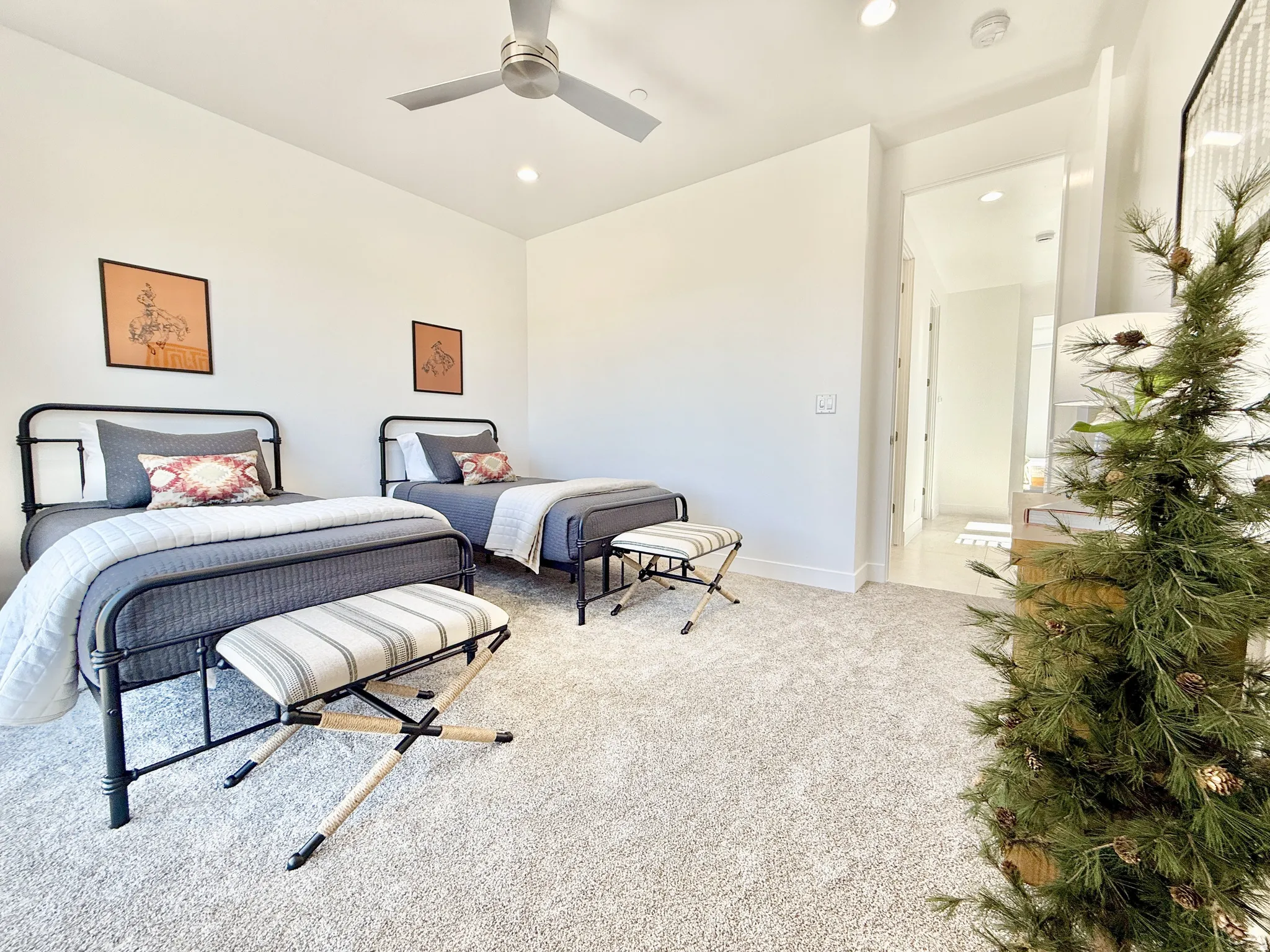 Recessed lighting, ceiling fan, and plush carpet flooring