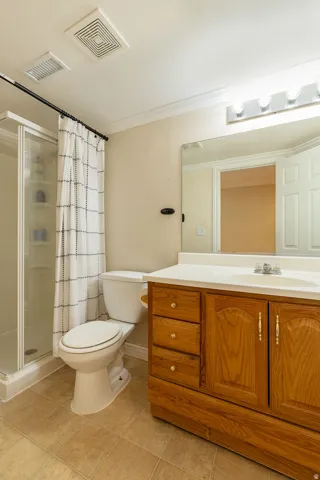 Wood-finish vanity with an integrated sink and base cabinetry