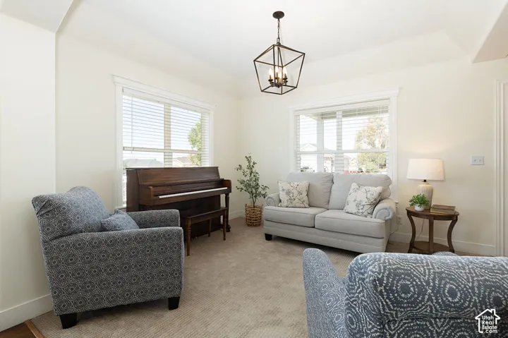 Recessed lighting, vaulted ceiling, large windows, ceiling-mounted light fixture, light-toned carpeting