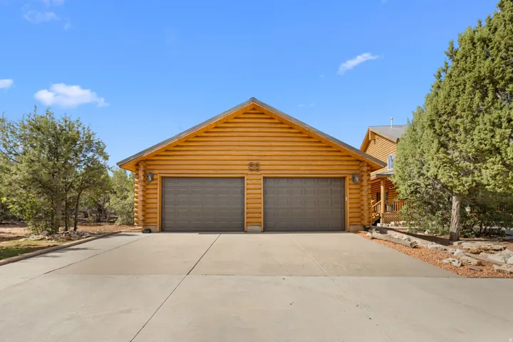 Log-sided exterior with a two-car garage