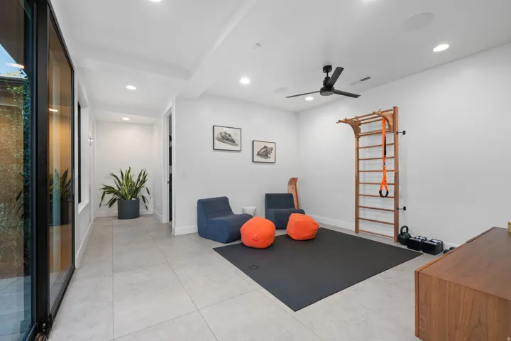 Recessed lighting, ceiling fan, and large format floor tile