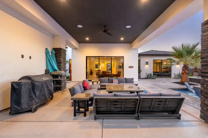 Expansive covered patio with recessed lighting and ceiling fan