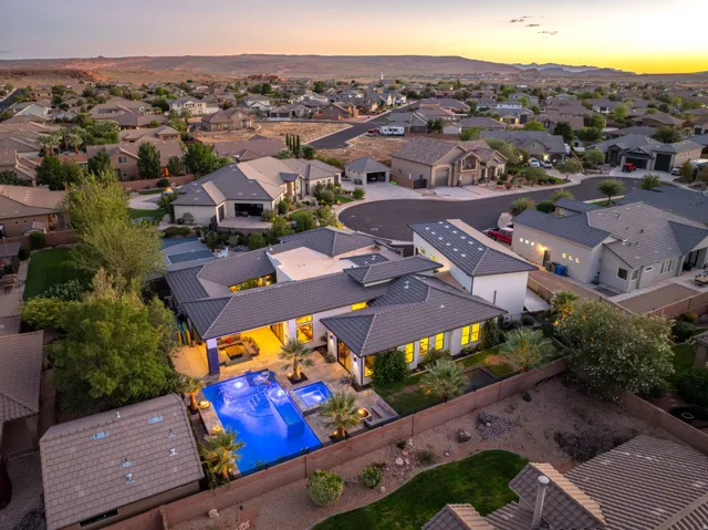 Modern residence with a multi-level roofline, integrated swimming pool, and a separate hot tub