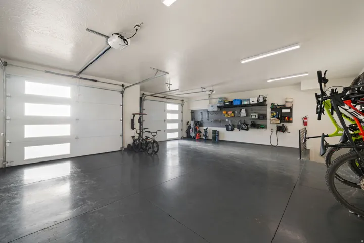 Two overhead garage doors with frosted glass panels