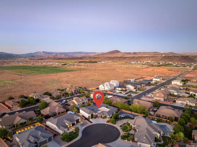Cul-de-sac location with established residential properties and undeveloped land