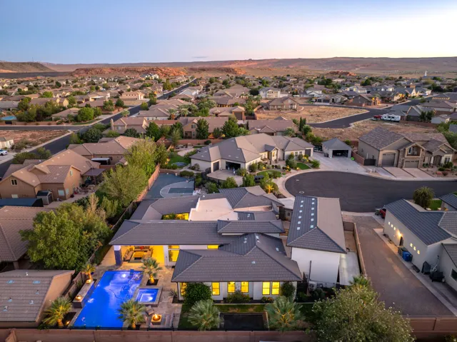 Contemporary home featuring a swimming pool, integrated spa, and an expansive patio