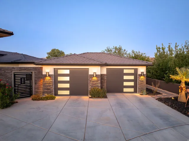 Two-car garage with modern doors featuring frosted glass panels