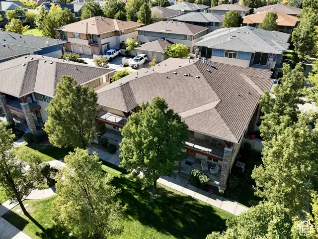 Multiple-unit property featuring prominent gabled roofs, stone facade accents, and balconies