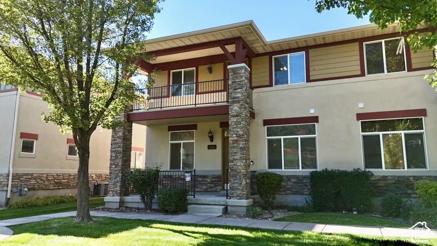 Stucco exterior with stacked stone accents