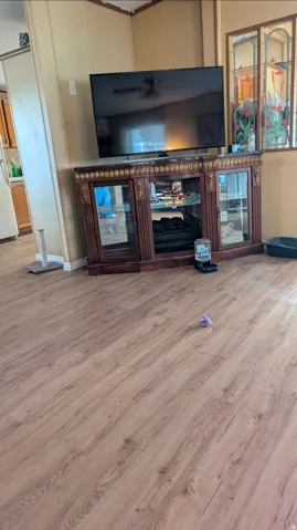 Wood-finish flooring throughout the space