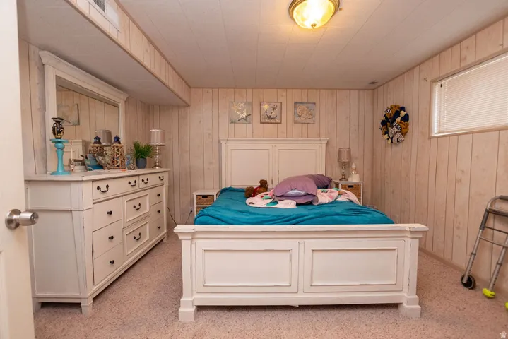 Wall-to-wall carpeting and wood-finish paneling