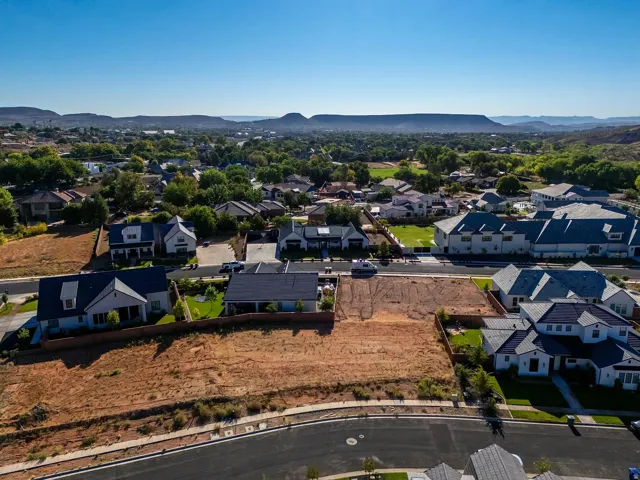 Expansive undeveloped land parcel with street access and mountain backdrop