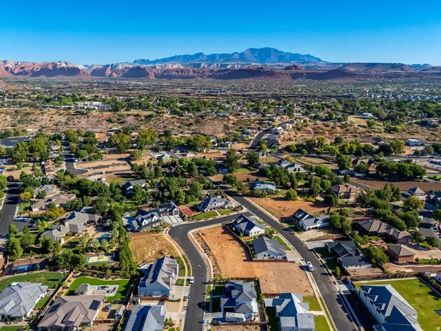 Residential community featuring established homes and undeveloped land parcels