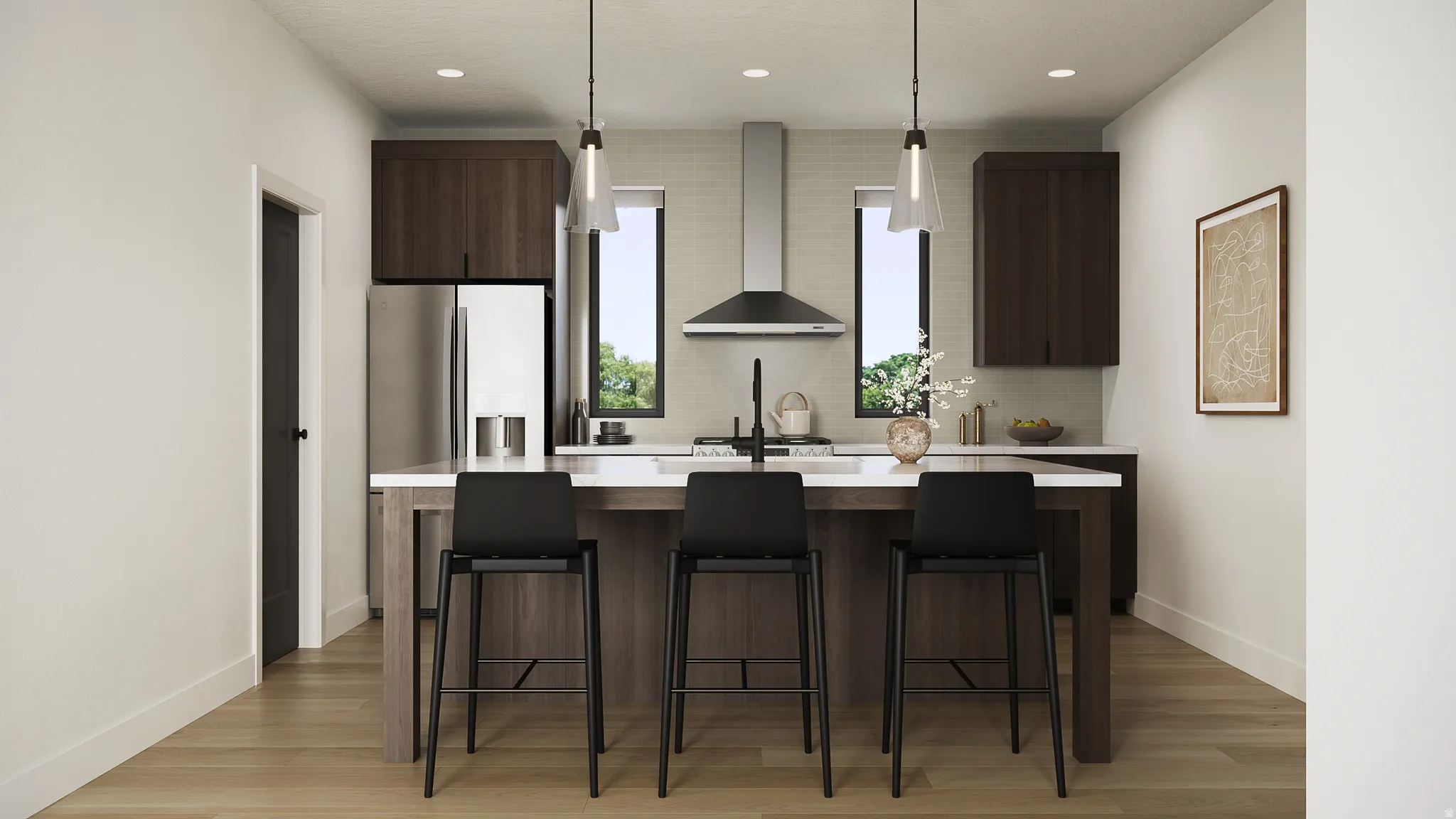 Kitchen featuring a central island with countertop seating, wood-finish cabinetry, stainless steel appliances, and pendant lighting
