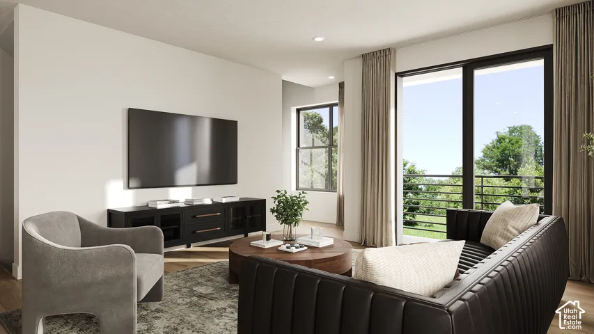 Hardwood-finish flooring, recessed lighting, and a built-in media console