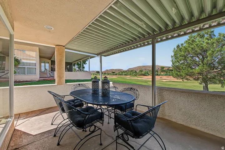Covered patio with recessed lighting, stucco exterior, and concrete flooring