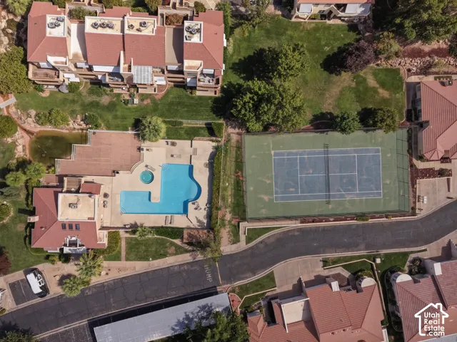 Community tennis court, large swimming pool, hot tub, and paved roadways