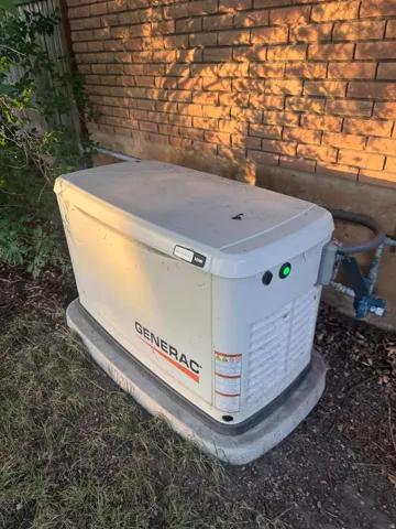 Generac whole-home generator with a brick exterior