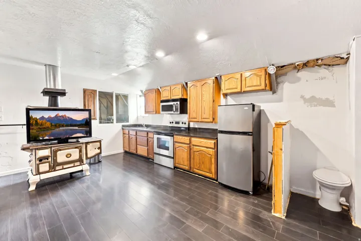 Wood-finish flooring throughout the space