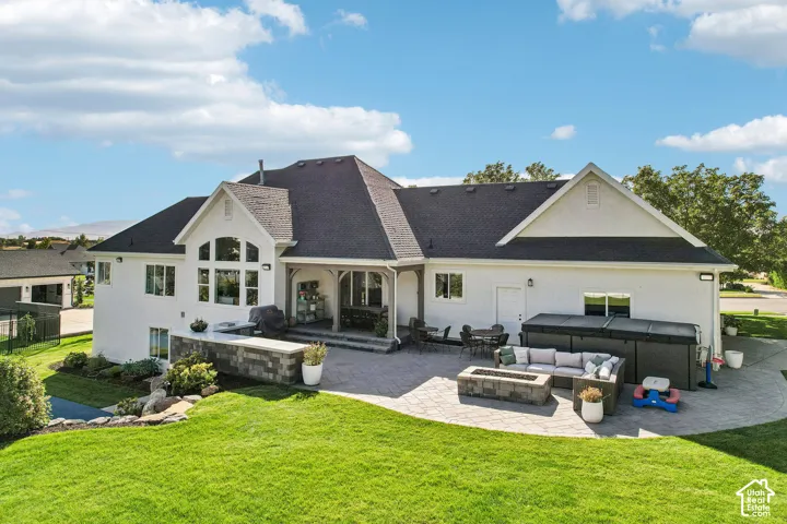 Expansive paver patio with a built-in fire pit