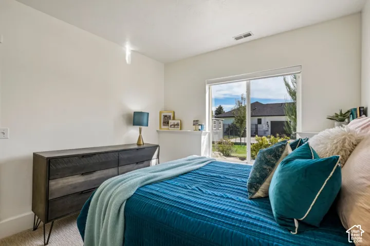 Neutral wall paint, large picture window, and recessed lighting