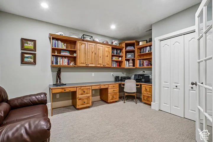 Built-in wood cabinetry with open shelving and closed storage