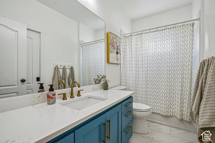 Spacious vanity with a white countertop and undermount sink