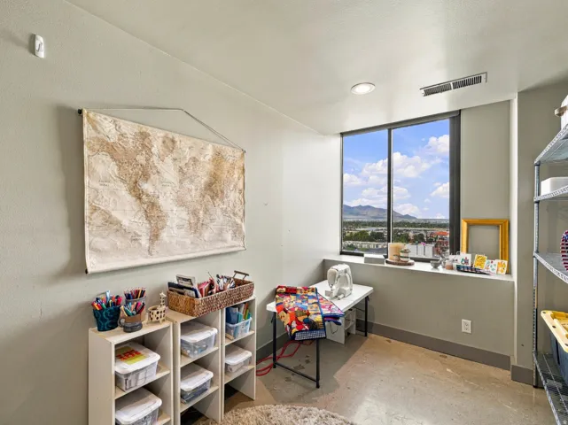 Window with expansive mountain and city scenery