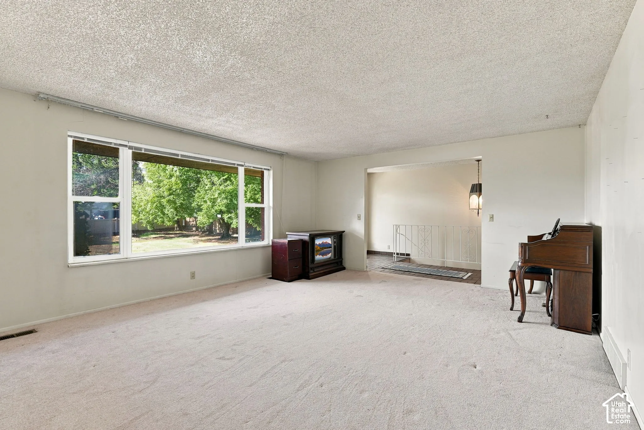 Spacious living area with broad windows