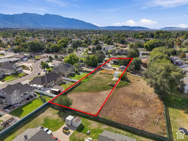 Expansive undeveloped land parcel with mountain backdrop