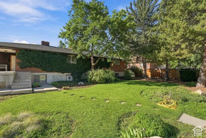 Extensive green lawn with established trees and mature landscaping