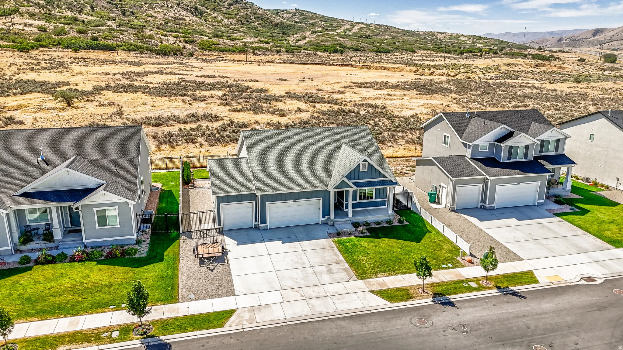 Ranch-style residence featuring a prominent front porch and a two-car garage