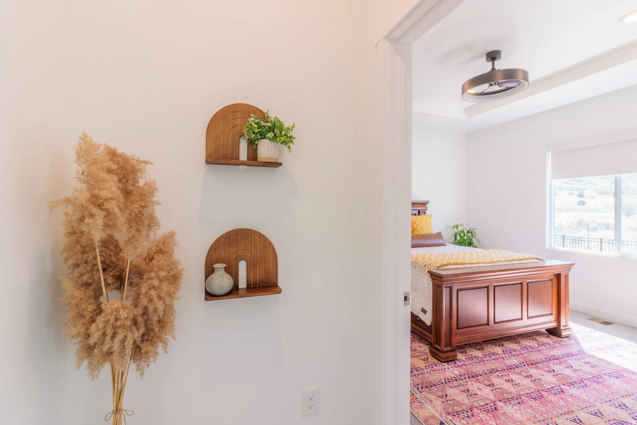 Recessed ceiling with a flush-mount ceiling fan and large window