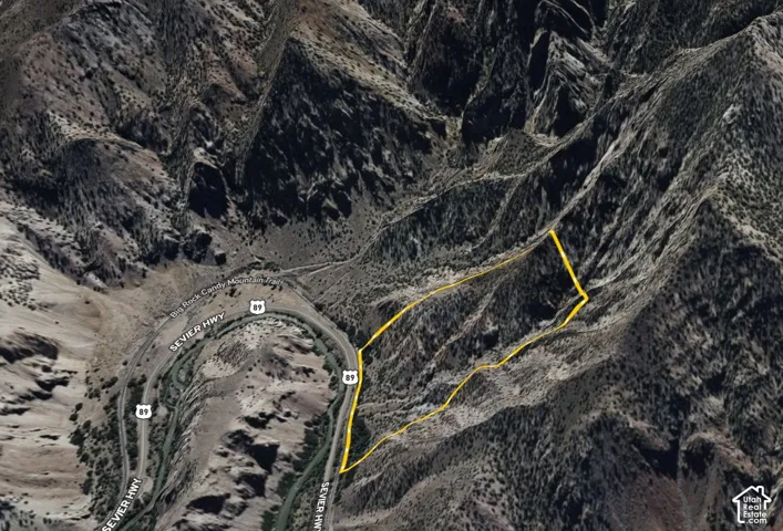 Aerial Property Map. Outlining the boundaries of the property in a mountainous region with an adjacent highway and river