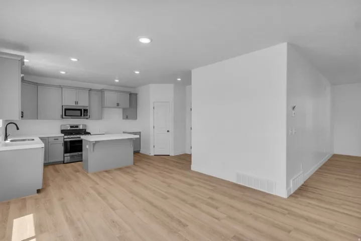 Open dining area adjacent to kitchen and family room.