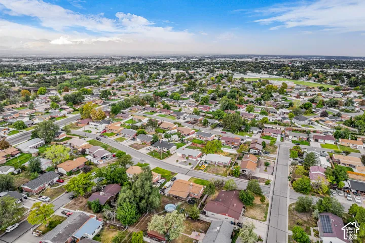Aerial perspective showcasing a residential neighborhood with a mix of single-story and multi-story homes